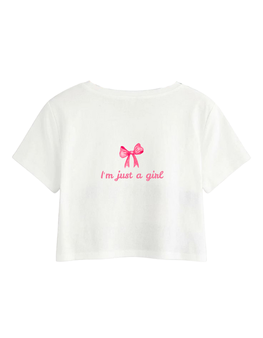 White t-shirt with pink bow and text on a white background