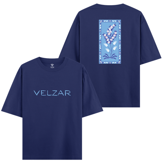 Royal blue t-shirt with 'VELZAR' branding on the front and floral design on the back.